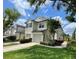Beautiful townhouse with manicured lawn, driveway and attached garages in a desirable neighborhood at 6059 Twain St # 108, Orlando, FL 32835