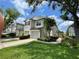 Charming two-story townhome with a well-manicured lawn and a welcoming front entrance at 6059 Twain St # 108, Orlando, FL 32835