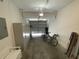 Clean, empty two-car garage with bikes and storage space at 6059 Twain St # 108, Orlando, FL 32835