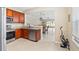 Kitchen with stainless steel appliances, granite countertops, and an open view of the dining area at 6059 Twain St # 108, Orlando, FL 32835