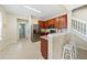 Well-lit kitchen with stainless steel appliances, dark cabinets, and a breakfast bar at 6059 Twain St # 108, Orlando, FL 32835