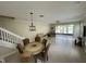 Bright and airy living room with sliding glass doors leading to a screened patio and lake view at 6059 Twain St # 108, Orlando, FL 32835
