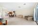 Expansive living room with tile floors, ample natural light, and an open layout to the kitchen at 6059 Twain St # 108, Orlando, FL 32835
