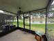 Screened lanai overlooking backyard and pond with fountain at 6059 Twain St # 108, Orlando, FL 32835