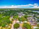 Aerial view of a neighborhood, highlighting the lush greenery and the overall community at 70 N Oak Ave, Umatilla, FL 32784