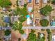 An aerial view displays the lot layout with a pool and mature trees in a residential area at 70 N Oak Ave, Umatilla, FL 32784