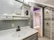 This bathroom features a sink and shower at 70 N Oak Ave, Umatilla, FL 32784
