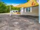 This home features a convenient carport with an awning that offers shade, enhancing outdoor comfort at 70 N Oak Ave, Umatilla, FL 32784