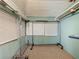 This closet features garment racks and two windows at 70 N Oak Ave, Umatilla, FL 32784