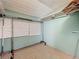 This closet features garment racks and three windows at 70 N Oak Ave, Umatilla, FL 32784