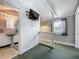 A hallway featuring stairs, a small bathroom, and unique decor at 70 N Oak Ave, Umatilla, FL 32784