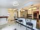 Kitchen area with an island bar and a view to the backyard through sliding glass doors at 70 N Oak Ave, Umatilla, FL 32784