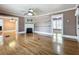 Spacious living room with hardwood floors, fireplace, and access to other rooms at 70 N Oak Ave, Umatilla, FL 32784