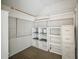 This office features shelving, a filing cabinet, and two windows at 70 N Oak Ave, Umatilla, FL 32784