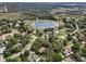Amazing aerial view showcasing the location, surrounding greenery, and lake at 994 Country Lake Cir, Lake Wales, FL 33898