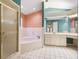 Large primary bathroom with a tub, shower, and double vanity at 994 Country Lake Cir, Lake Wales, FL 33898