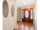 Inviting entryway with stylish tile floors, a decorative front door and a coat closet at 994 Country Lake Cir, Lake Wales, FL 33898