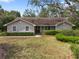Charming single-story home featuring well-maintained lawn and landscaping at 994 Country Lake Cir, Lake Wales, FL 33898