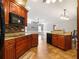 Kitchen with granite countertops, custom cabinets, tile backsplash, and stainless steel appliances at 994 Country Lake Cir, Lake Wales, FL 33898
