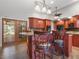 Spacious kitchen with seating, granite countertops, custom cabinets, and tile floors at 994 Country Lake Cir, Lake Wales, FL 33898