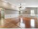 Bright and airy living room featuring a vaulted ceiling, hardwood floors, and lots of natural light at 994 Country Lake Cir, Lake Wales, FL 33898