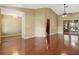 Open living room featuring hardwood floors, and vaulted ceilings at 994 Country Lake Cir, Lake Wales, FL 33898