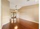 Spacious living room boasting hardwood floors, vaulted ceilings, and ample natural light at 994 Country Lake Cir, Lake Wales, FL 33898