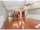 Open concept living room with hardwood floors adjacent to the kitchen at 994 Country Lake Cir, Lake Wales, FL 33898