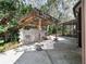 Outdoor patio area featuring a stone grill area with pergola at 994 Country Lake Cir, Lake Wales, FL 33898