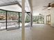 Spacious screened-in patio featuring brick flooring and views of the outdoor kitchen at 994 Country Lake Cir, Lake Wales, FL 33898