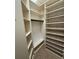Large walk-in closet with multiple shelves and rods at 1608 Fox Glen Ct, Winter Springs, FL 32708