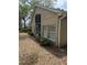 Home exterior featuring a screened lanai, well-maintained landscaping, and a serene backyard setting at 1608 Fox Glen Ct, Winter Springs, FL 32708
