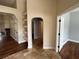 Open-concept foyer with tile flooring and archway details at 1608 Fox Glen Ct, Winter Springs, FL 32708