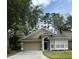 Charming single-Gathering home with well-manicured lawn and two-car garage at 1608 Fox Glen Ct, Winter Springs, FL 32708