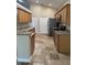 The kitchen features granite counters, stainless appliances and tile floors at 1608 Fox Glen Ct, Winter Springs, FL 32708