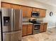 Kitchen with stainless steel appliances, granite countertops, and ample cabinet space at 1608 Fox Glen Ct, Winter Springs, FL 32708