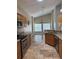 Open concept kitchen with granite countertops and stainless steel appliances at 1608 Fox Glen Ct, Winter Springs, FL 32708