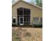Rear exterior view of the screened in lanai with high ceilings offering peaceful views at 1608 Fox Glen Ct, Winter Springs, FL 32708