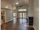 Spacious living room features vaulted ceiling, fireplace, and wood-look flooring at 1608 Fox Glen Ct, Winter Springs, FL 32708