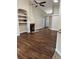 Open living space with vaulted ceiling, fireplace and built-in shelving at 1608 Fox Glen Ct, Winter Springs, FL 32708