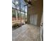 This screened patio has tile flooring and ceiling fan and provides ample room for relaxing and enjoying the outdoors at 1608 Fox Glen Ct, Winter Springs, FL 32708