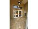 Covered rear patio with tiled flooring featuring a ceiling fan, and double glass doors leading to the interior at 1608 Fox Glen Ct, Winter Springs, FL 32708