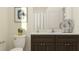 Elegant bathroom featuring a modern vanity, sleek fixtures, and a shower-tub combination at 4759 Waltham Forest Dr, Davenport, FL 33837