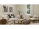 Cozy living room with stylish furniture, neutral tones, and natural light at 4759 Waltham Forest Dr, Davenport, FL 33837