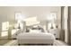 Bright main bedroom featuring a cozy bed, decorative pillows, and bedside tables with lamps at 4759 Waltham Forest Dr, Davenport, FL 33837