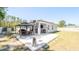 Spacious backyard with a covered patio, dining set, and privacy fence at 8007 Sw 135Th Loop, Ocala, FL 34473