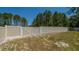 A double gate in the backyard fence allows access to the property at 8007 Sw 135Th Loop, Ocala, FL 34473