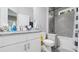 Bright bathroom with granite counters, tile floors, and a shower-tub combo for a serene experience at 8007 Sw 135Th Loop, Ocala, FL 34473