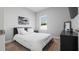 Bright bedroom with neutral tones, a comfortable bed, modern furnishings, and a window at 8007 Sw 135Th Loop, Ocala, FL 34473