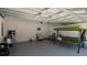 The spacious garage is perfect for a workshop or storing hobbies at 8007 Sw 135Th Loop, Ocala, FL 34473